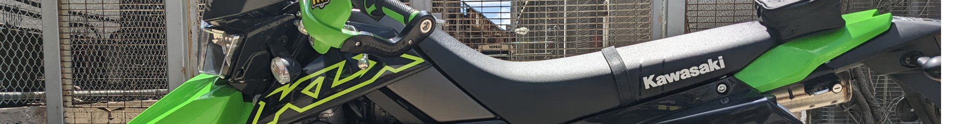 Green and black Kawasaki motorcycle