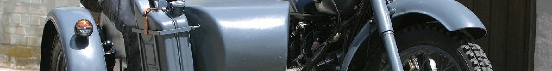 blue-grey motorcycle with side car attached 