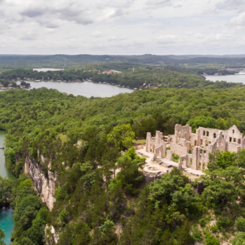 Deteriorated stone mansion on a cliff overlooking the Ozark