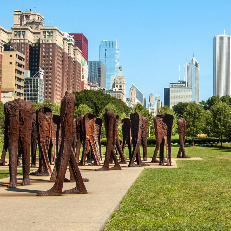 Winding roading with trees on the side of the road changing to red and orange colors