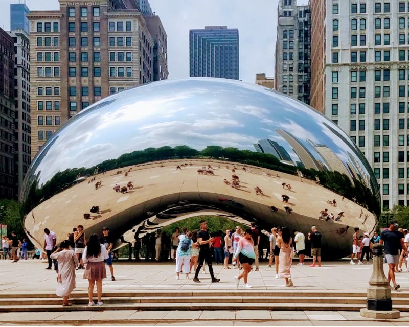 People taking photos around The Bean in Chicago, IL 